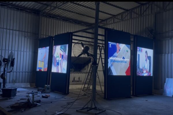 Capital Arts Digital Signage Testing – Workshop Pre-Assembly commercial digital display totems and video screens being illuminated and tested inside the Capital Arts manufacturing workshop.